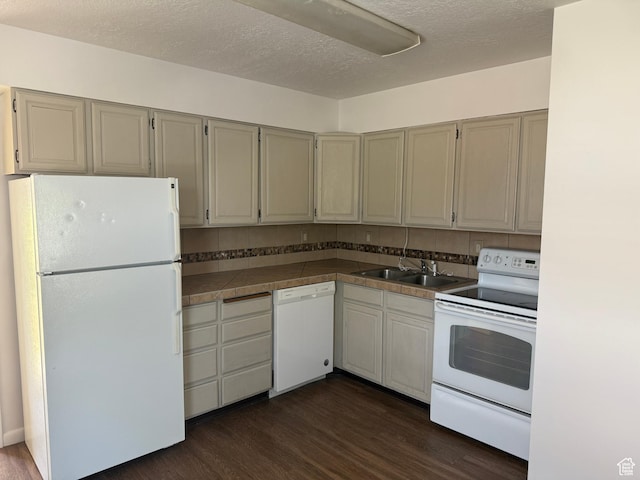 2168 S Harrison Blvd, Ogden, UT 84401 - kitchen with white appliances, a sink, dark wood finished floors, and a textured ceiling