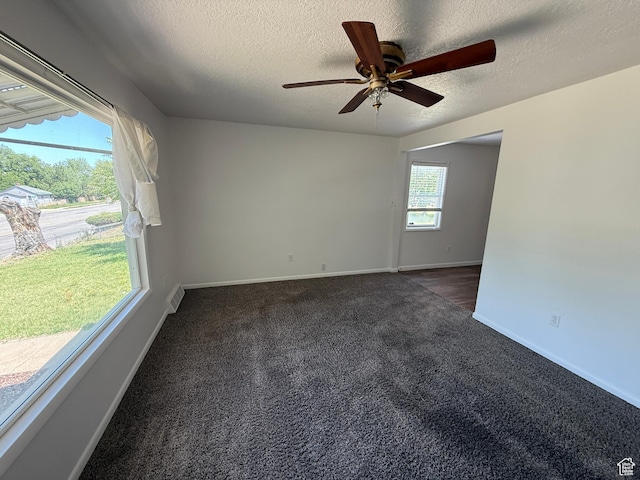 2168 S Harrison Blvd, Ogden, UT 84401 - unfurnished room featuring dark carpet, a textured ceiling, a ceiling fan, and baseboards