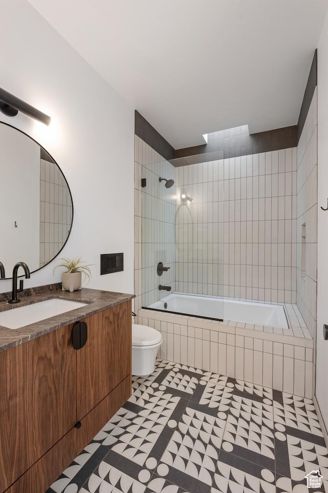 3147 S Mesa Verde Cir, Hurricane, UT 84737 - bathroom with toilet, vanity, tile patterned floors, and tiled shower / bath combo