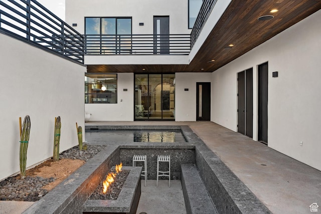 3147 S Mesa Verde Cir, Hurricane, UT 84737 - view of patio / terrace with a fire pit and a balcony