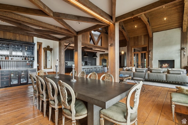 7701 N W Hills Trl, Park City, UT 84098 - dining room with hardwood / wood-style floors and a large fireplace