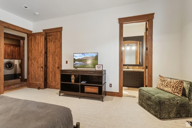 7701 N W Hills Trl, Park City, UT 84098 - bedroom with separate washer and dryer, carpet floors, ensuite bath, and a sink