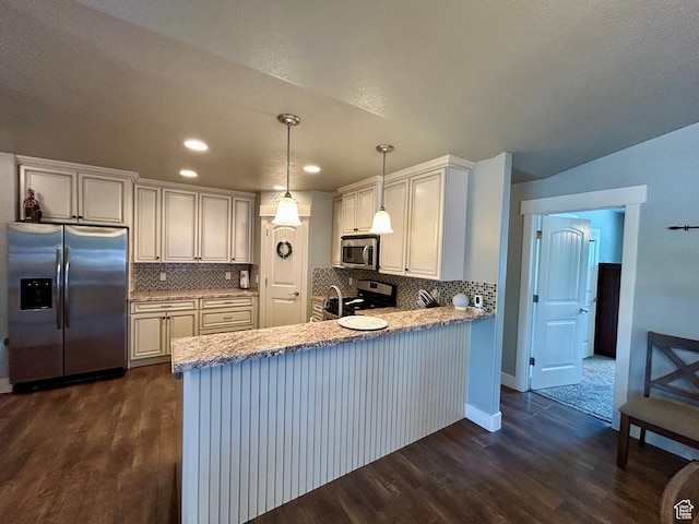 319 S 600 E, Payson, UT 84651 - kitchen with stainless steel appliances, dark wood-type flooring, a peninsula, tasteful backsplash, and recessed lighting