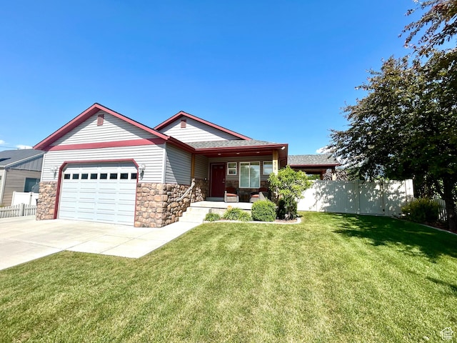 319 S 600 E, Payson, UT 84651 - view of front facade featuring stone siding, an attached garage, concrete driveway, and covered porch