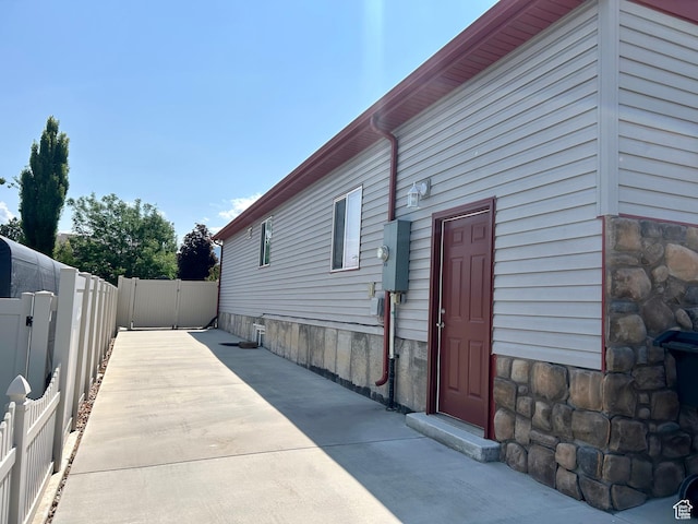 319 S 600 E, Payson, UT 84651 - view of home's exterior featuring stone siding and a patio area