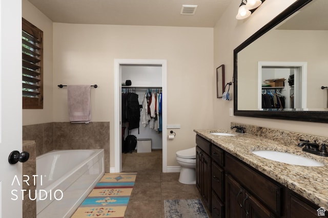 2565 N Sunset Vw Unit 14, Lehi, UT 84043 - bathroom with double vanity, a garden tub, a spacious closet, toilet, and tile patterned floors