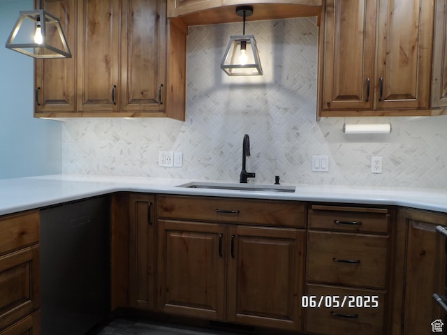 288 W 775 N, Logan, UT 84321 - kitchen featuring a sink, black dishwasher, decorative backsplash, and light countertops