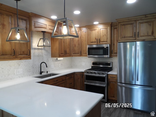 288 W 775 N, Logan, UT 84321 - kitchen with appliances with stainless steel finishes, a sink, light countertops, tasteful backsplash, and recessed lighting