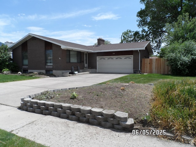 288 W 775 N, Logan, UT 84321 - ranch-style home featuring brick siding, driveway, an attached garage, and a chimney