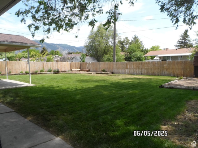 288 W 775 N, Logan, UT 84321 - view of yard featuring a mountain view and a patio area