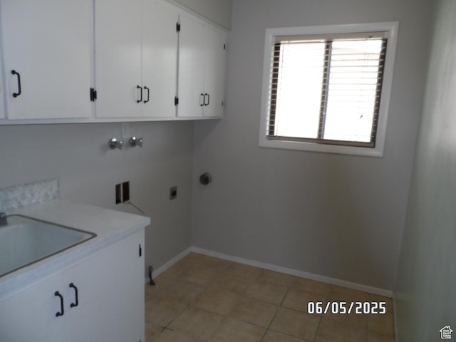 288 W 775 N, Logan, UT 84321 - laundry room with cabinet space, baseboards, hookup for a washing machine, electric dryer hookup, and light tile patterned flooring