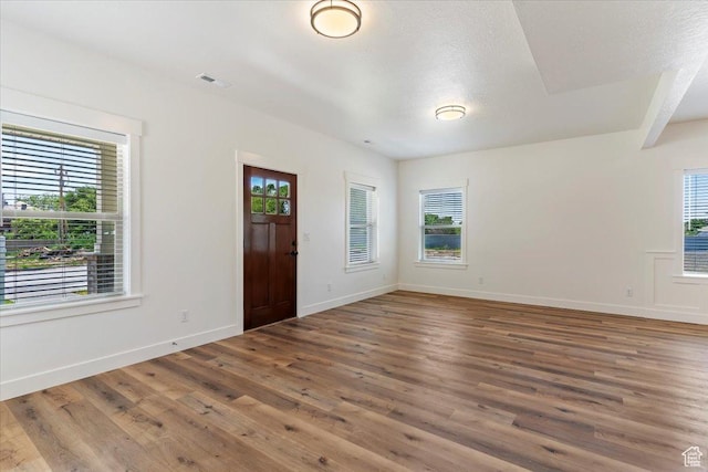 874 Cahoon St, Ogden, UT 84401 - foyer featuring plenty of natural light, wood finished floors, and baseboards
