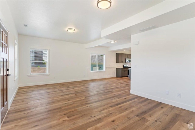 874 Cahoon St, Ogden, UT 84401 - unfurnished living room featuring light wood finished floors and baseboards