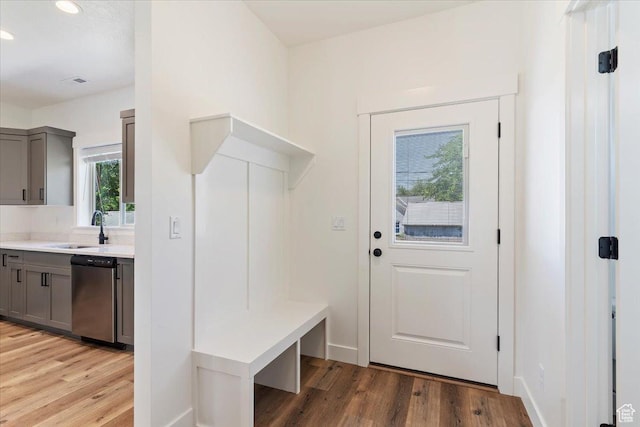 874 Cahoon St, Ogden, UT 84401 - mudroom featuring a sink, light wood-style flooring, recessed lighting, and baseboards