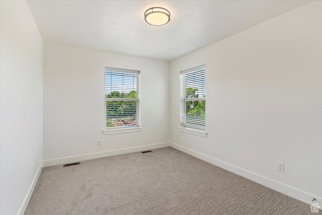 874 Cahoon St, Ogden, UT 84401 - empty room featuring baseboards and light colored carpet