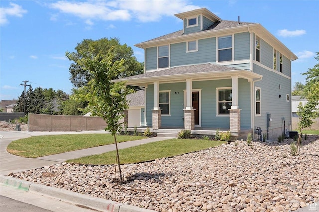 874 Cahoon St, Ogden, UT 84401 - american foursquare style home with a porch and central AC unit
