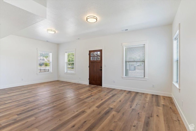 874 Cahoon St, Ogden, UT 84401 - empty room featuring wood finished floors and baseboards