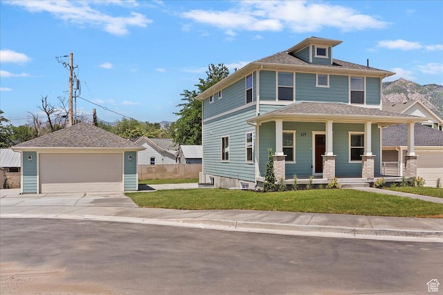 874 Cahoon St, Ogden, UT 84401 - view of front facade with covered porch, a garage, a front lawn, and an outdoor structure