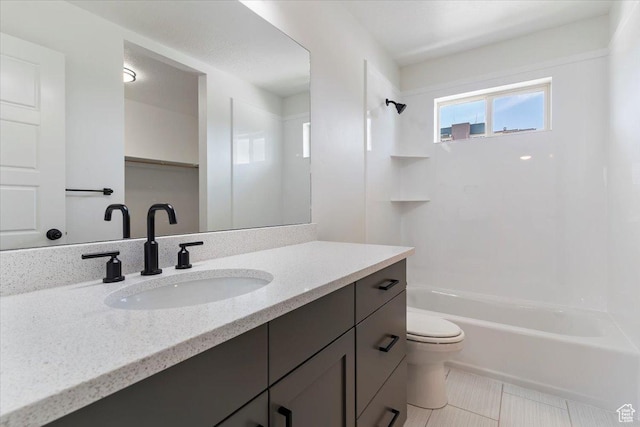 874 Cahoon St, Ogden, UT 84401 - full bathroom featuring toilet, vanity, shower / washtub combination, and tile patterned floors