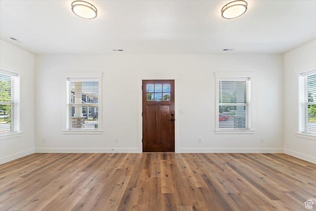874 Cahoon St, Ogden, UT 84401 - foyer featuring light wood-style flooring and baseboards