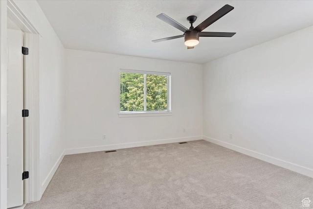 874 Cahoon St, Ogden, UT 84401 - unfurnished room featuring baseboards, light colored carpet, and ceiling fan