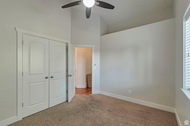 222 E 905 N, Orem, UT 84057 - unfurnished bedroom featuring carpet flooring, a closet, baseboards, a ceiling fan, and vaulted ceiling