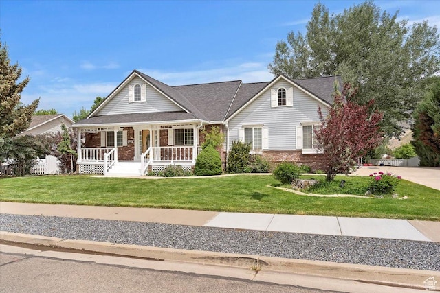 595 E 100 S, Morgan, UT 84050 - view of front of property featuring brick siding, a porch, and a front lawn