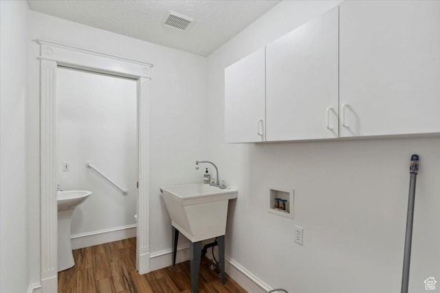 595 E 100 S, Morgan, UT 84050 - washroom featuring washer hookup, wood finished floors, cabinet space, and baseboards