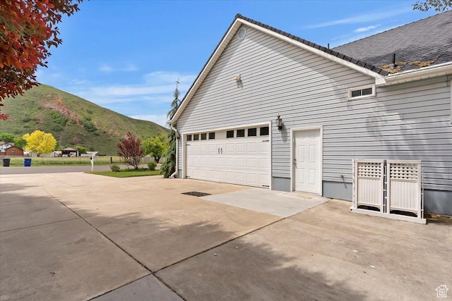 595 E 100 S, Morgan, UT 84050 - view of side of property with a mountain view and concrete driveway