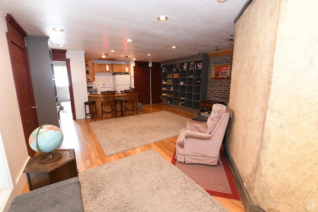 145 E 100 S, Farmington, UT 84025 - living area featuring light wood-style flooring, recessed lighting, and crown molding
