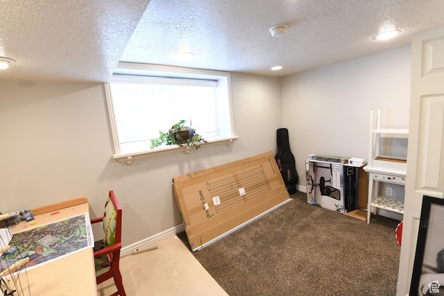 145 E 100 S, Farmington, UT 84025 - home office featuring a textured ceiling, dark colored carpet, and baseboards