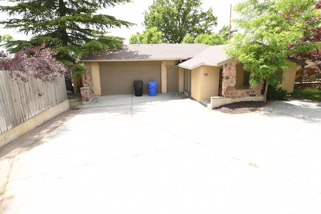 145 E 100 S, Farmington, UT 84025 - view of front of property with a garage, stucco siding, driveway, and stone siding
