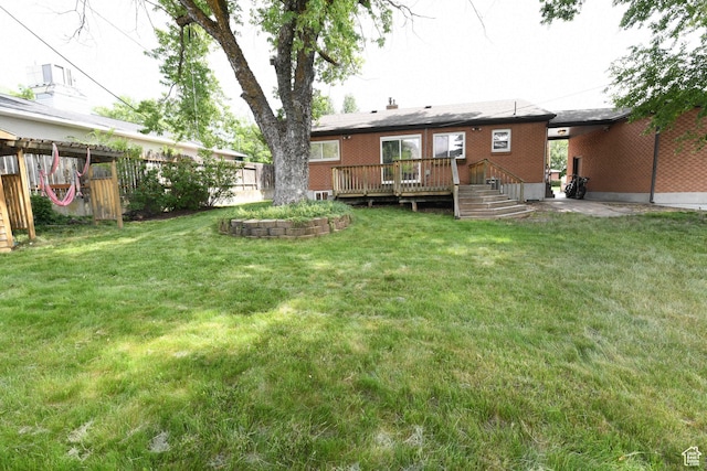 145 E 100 S, Farmington, UT 84025 - rear view of house featuring a wooden deck and brick siding