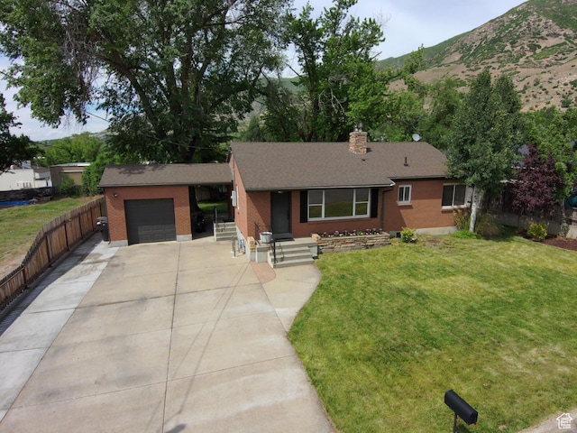 145 E 100 S, Farmington, UT 84025 - ranch-style house with an attached garage, brick siding, concrete driveway, a shingled roof, and a chimney
