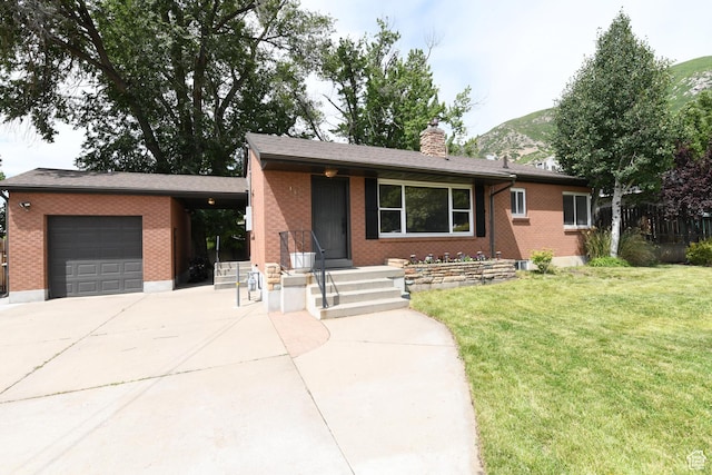 145 E 100 S, Farmington, UT 84025 - view of front of home with an attached garage, concrete driveway, a chimney, and a front yard