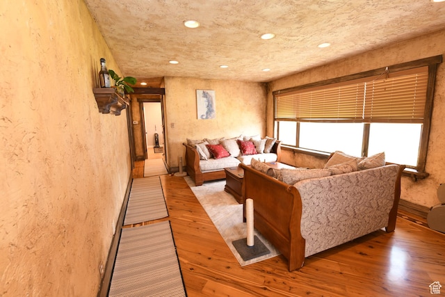 145 E 100 S, Farmington, UT 84025 - living room with a textured wall, light wood-style flooring, and recessed lighting
