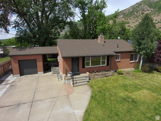145 E 100 S, Farmington, UT 84025 - single story home with a garage, driveway, brick siding, and a chimney