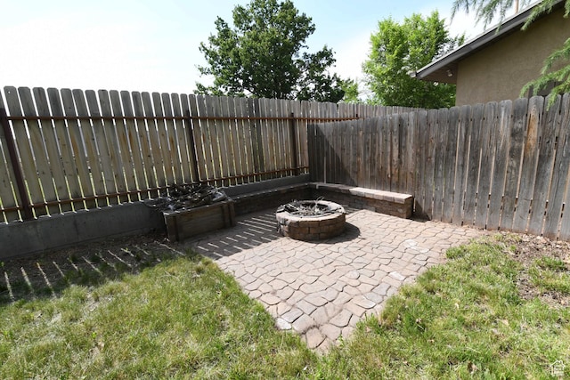 145 E 100 S, Farmington, UT 84025 - fenced backyard with a fire pit and a patio area