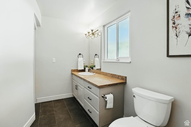 7585 S 3500 E, Salt Lake City, UT 84121 - bathroom featuring vanity, toilet, tile patterned floors, and baseboards