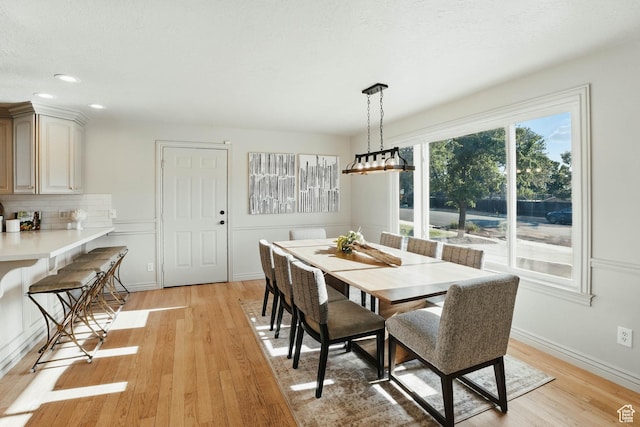 7585 S 3500 E, Salt Lake City, UT 84121 - dining area with light wood finished floors, recessed lighting, and baseboards