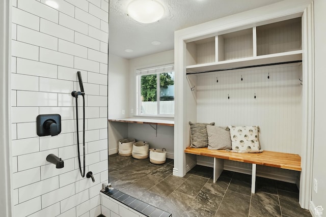 7585 S 3500 E, Salt Lake City, UT 84121 - mudroom with baseboards and a textured ceiling