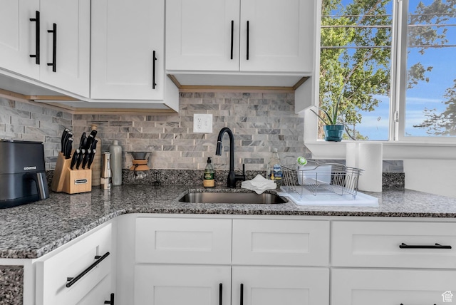 158 N 900 W, Provo, UT 84601 - kitchen featuring a sink, plenty of natural light, backsplash, and white cabinetry