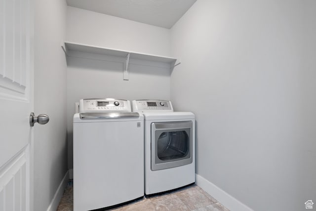 4959 Sagebrush Ln E, Eagle Mountain, UT 84005 - washroom with washer and dryer and baseboards