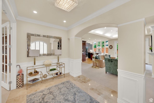 7195 S Villandrie Ln E, Cottonwood Heights, UT 84121 - foyer entrance with arched walkways, recessed lighting, a wainscoted wall, crown molding, and a decorative wall