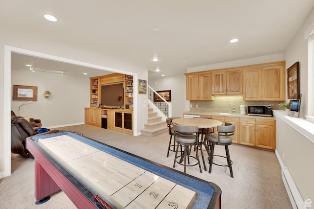 7195 S Villandrie Ln E, Cottonwood Heights, UT 84121 - kitchen featuring light brown cabinets, light colored carpet, light countertops, backsplash, and a baseboard radiator