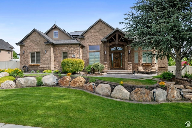 2908 W Bison Ridge Rd, South Jordan, UT 84095 - view of front of home featuring roof mounted solar panels and brick siding