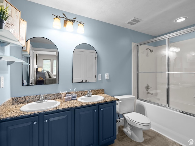 6749 N 2200 W Unit B-303, Park City, UT 84098 - full bathroom with double vanity, toilet, tile patterned floors, combined bath / shower with glass door, and ensuite bath