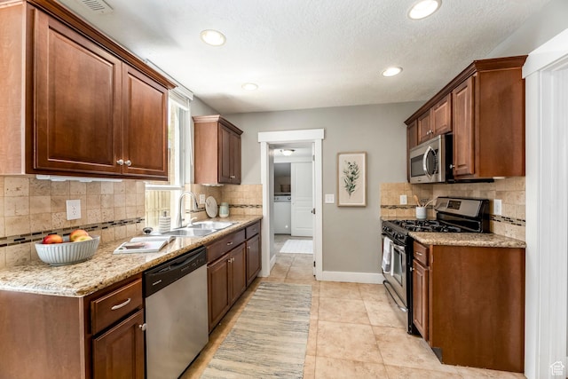 1860 S 800 E, Salt Lake City, UT 84105 - kitchen featuring stainless steel appliances, a sink, tasteful backsplash, baseboards, and recessed lighting