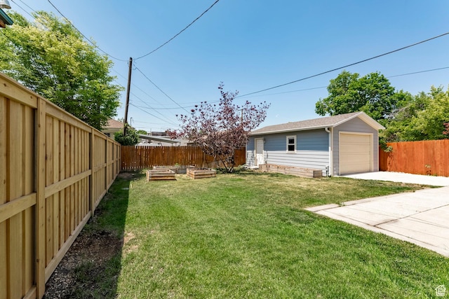 1860 S 800 E, Salt Lake City, UT 84105 - view of yard featuring an outbuilding, a garden, a detached garage, and driveway