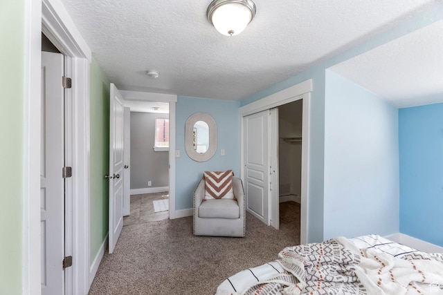 1860 S 800 E, Salt Lake City, UT 84105 - carpeted bedroom featuring a closet, a textured ceiling, and baseboards